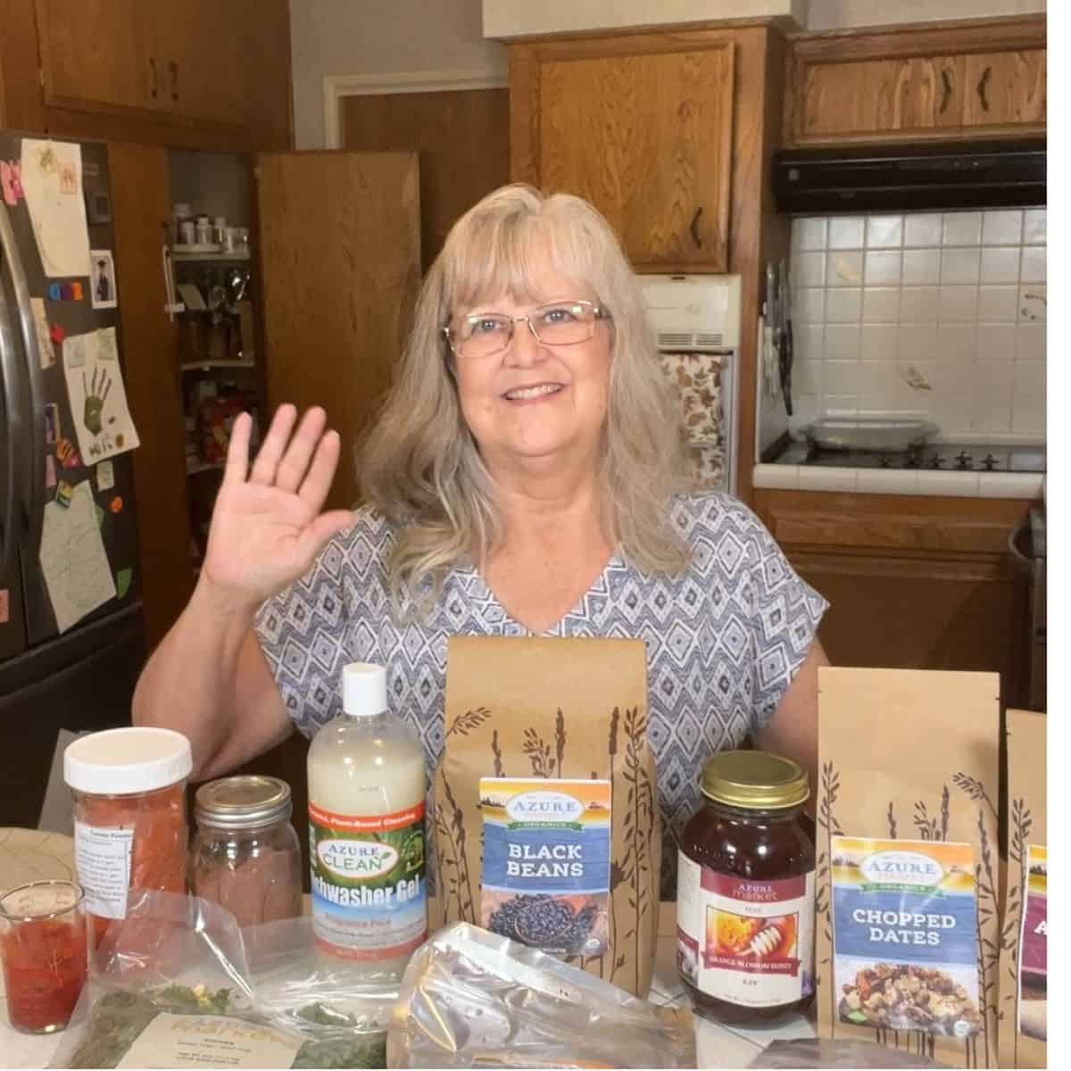 The Common Sense Grandma sharing an Azure Standard grocery haul with organic pantry staples, honey, beans, yeast, and tomato powder.